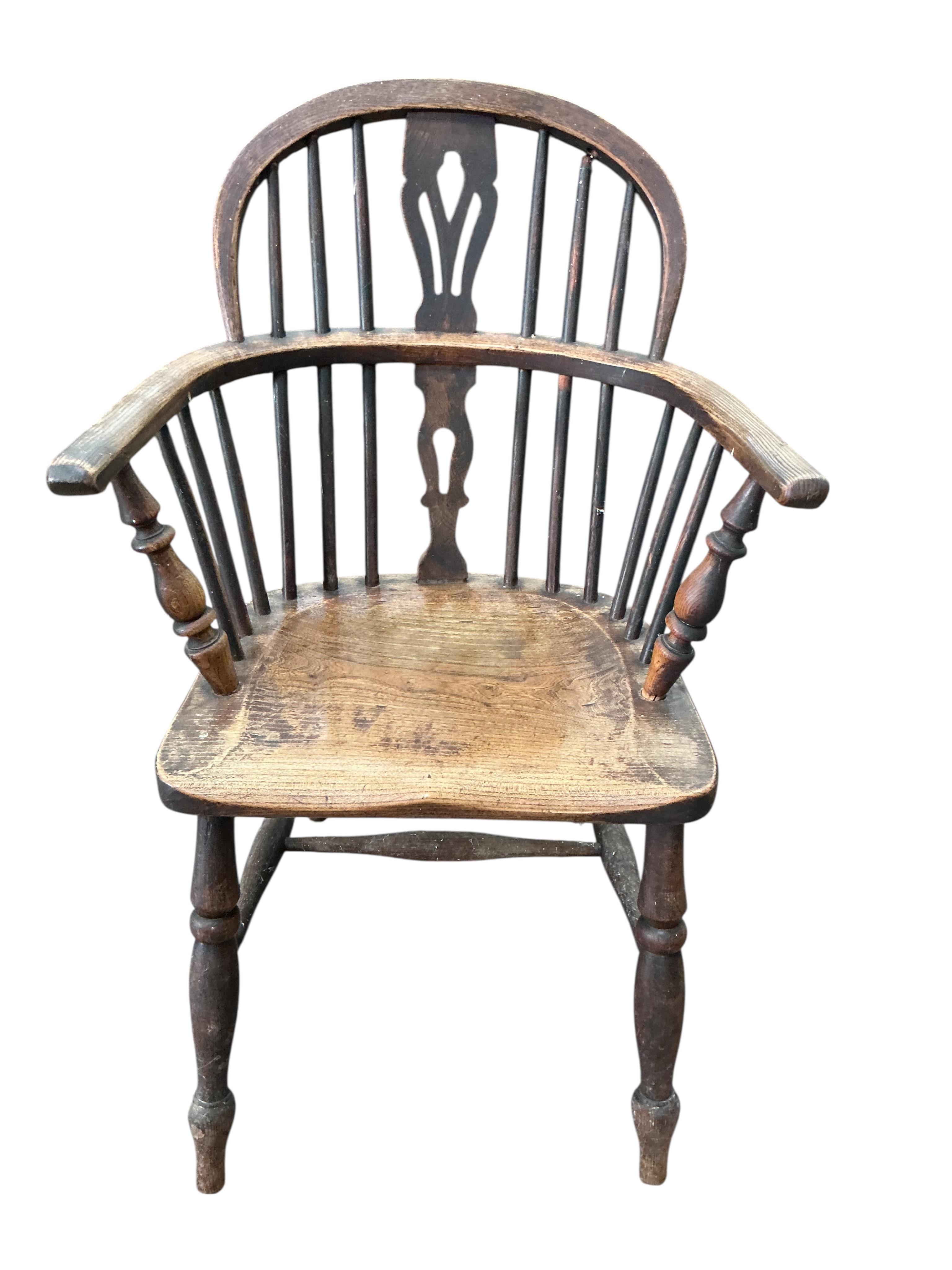 A mid 19th century ash and elm Windsor elbow chair, width 56cm, depth 37cm, height 91cm
